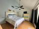 Main bedroom with king-size bed, dresser, and access to balcony at 19930 Gulf Blvd # 1A, Indian Shores, FL 33785