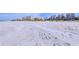 Expansive beach view with white sand and oceanfront property at 19930 Gulf Blvd # 1A, Indian Shores, FL 33785