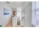 Upstairs hallway with light walls and wood floors at 19930 Gulf Blvd # 1A, Indian Shores, FL 33785
