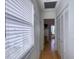 Bright hallway with wood floors and built-in storage at 19930 Gulf Blvd # 1A, Indian Shores, FL 33785