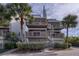 Two-story beach condo building with spiral staircases at 19930 Gulf Blvd # 1A, Indian Shores, FL 33785