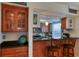 Well-equipped kitchen with wood cabinets and granite counters at 19930 Gulf Blvd # 1A, Indian Shores, FL 33785
