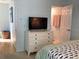 Bedroom with a full-size bed, dresser and TV at 19930 Gulf Blvd # 1A, Indian Shores, FL 33785