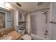 Bathroom with tub, shower, granite vanity, and cabinet at 19930 Gulf Blvd # 1A, Indian Shores, FL 33785