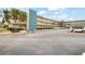 Spacious condominium complex with ample parking and lush landscaping, conveniently located near palm trees at 5750 80Th N St # B208, St Petersburg, FL 33709