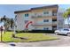 Charming condo exterior with balconies and well-manicured landscaping, plus convenient parking at 5750 80Th N St # B208, St Petersburg, FL 33709