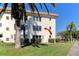 Lovely condo exterior with well-maintained landscaping and convenient access to parking at 5750 80Th N St # B208, St Petersburg, FL 33709