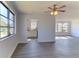 Bright living room with new flooring and large windows at 5750 80Th N St # B208, St Petersburg, FL 33709