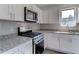 Stylish kitchen, granite countertops, stainless steel appliances at 5750 80Th N St # B208, St Petersburg, FL 33709