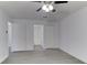 Bright bedroom with ceiling fan and grey flooring at 5750 80Th N St # B208, St Petersburg, FL 33709