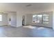 Open living room and kitchen with new flooring at 5750 80Th N St # B208, St Petersburg, FL 33709