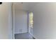 Hallway with access to balcony and neutral decor at 5750 80Th N St # B208, St Petersburg, FL 33709