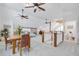 Open sitting area with a dining table, chairs, and a view of the main bedroom at 3136 Neff Lake Rd, Brooksville, FL 34602
