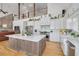 Updated kitchen featuring a sizable island, white shaker cabinets, and stainless steel appliances at 3136 Neff Lake Rd, Brooksville, FL 34602