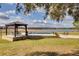 Pool and patio with gazebo overlooking lake at 3136 Neff Lake Rd, Brooksville, FL 34602