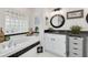 Relaxing bathroom features a soaking tub, granite countertop vanity, and a decorative mirror at 3136 Neff Lake Rd, Brooksville, FL 34602