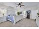 Bright bedroom features a large bed, plenty of natural light, and neutral color tones at 3136 Neff Lake Rd, Brooksville, FL 34602