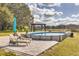 Inviting pool area with lounge chairs and a pergola at 3136 Neff Lake Rd, Brooksville, FL 34602