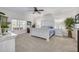 Charming bedroom with a queen-size bed, ample natural light, and a relaxing atmosphere at 3136 Neff Lake Rd, Brooksville, FL 34602