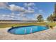 Stunning pool with a view of a lake and landscape at 3136 Neff Lake Rd, Brooksville, FL 34602