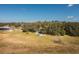 Aerial view showing house, pool and lakefront property at 3136 Neff Lake Rd, Brooksville, FL 34602