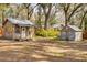 Two rustic wooden sheds in a wooded area at 3136 Neff Lake Rd, Brooksville, FL 34602