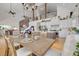 Farmhouse dining room with a large wooden table and a view of the kitchen and living area at 3136 Neff Lake Rd, Brooksville, FL 34602