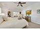 Serene bedroom with a queen-size bed, large window, and plenty of natural light at 3136 Neff Lake Rd, Brooksville, FL 34602