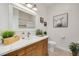 Clean bathroom features a vanity with a quartz countertop and a large mirror at 3136 Neff Lake Rd, Brooksville, FL 34602