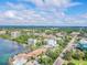 Aerial view of coastal city featuring waterfront property, buildings, and lush green spaces at 570 Casler Ave, Clearwater, FL 33755