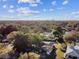 House nestled amongst lush trees near a lake at 570 Casler Ave, Clearwater, FL 33755