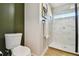 Bathroom with toilet and walk-in shower at 570 Casler Ave, Clearwater, FL 33755