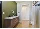 Modern bathroom with double vanity and access to closet at 570 Casler Ave, Clearwater, FL 33755