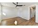 Bright bedroom with hardwood floors and ceiling fan at 570 Casler Ave, Clearwater, FL 33755