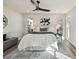 Bright bedroom with a king-size bed and large windows at 570 Casler Ave, Clearwater, FL 33755