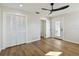 Bedroom with hardwood floors, ceiling fan, and closet at 570 Casler Ave, Clearwater, FL 33755