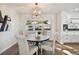 Bright dining area with a round table and four chairs, and large window at 570 Casler Ave, Clearwater, FL 33755