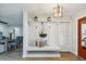 Bright and airy entryway with a built in bench and storage at 570 Casler Ave, Clearwater, FL 33755
