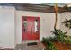 Inviting entryway with a red double door and a welcome mat at 570 Casler Ave, Clearwater, FL 33755