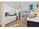 Modern kitchen with white cabinets, quartz countertops, and a large island at 570 Casler Ave, Clearwater, FL 33755