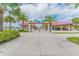 Entrance to Pier 60, featuring palm trees and beach access at 570 Casler Ave, Clearwater, FL 33755