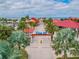 Aerial view of Pier 60 entrance, beach, and palm trees at 570 Casler Ave, Clearwater, FL 33755