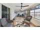 Relaxing sunroom with wicker furniture and ample natural light at 570 Casler Ave, Clearwater, FL 33755