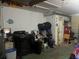 An attached garage with washer and dryer, and ample storage space at 1153 Tamarac Dr, Holiday, FL 34690