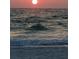 Serene ocean view at sunset with gentle waves at 1153 Tamarac Dr, Holiday, FL 34690