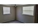 Simple bedroom with neutral walls and carpeting at 1153 Tamarac Dr, Holiday, FL 34690