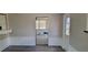 View of dining area with access to sunroom at 1153 Tamarac Dr, Holiday, FL 34690
