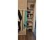 A small closet with shelving for storage at 1153 Tamarac Dr, Holiday, FL 34690