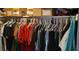 Well-organized closet with many clothes on hangers at 1153 Tamarac Dr, Holiday, FL 34690