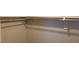 Basic reach-in closet with a single rod for hanging clothes at 1153 Tamarac Dr, Holiday, FL 34690